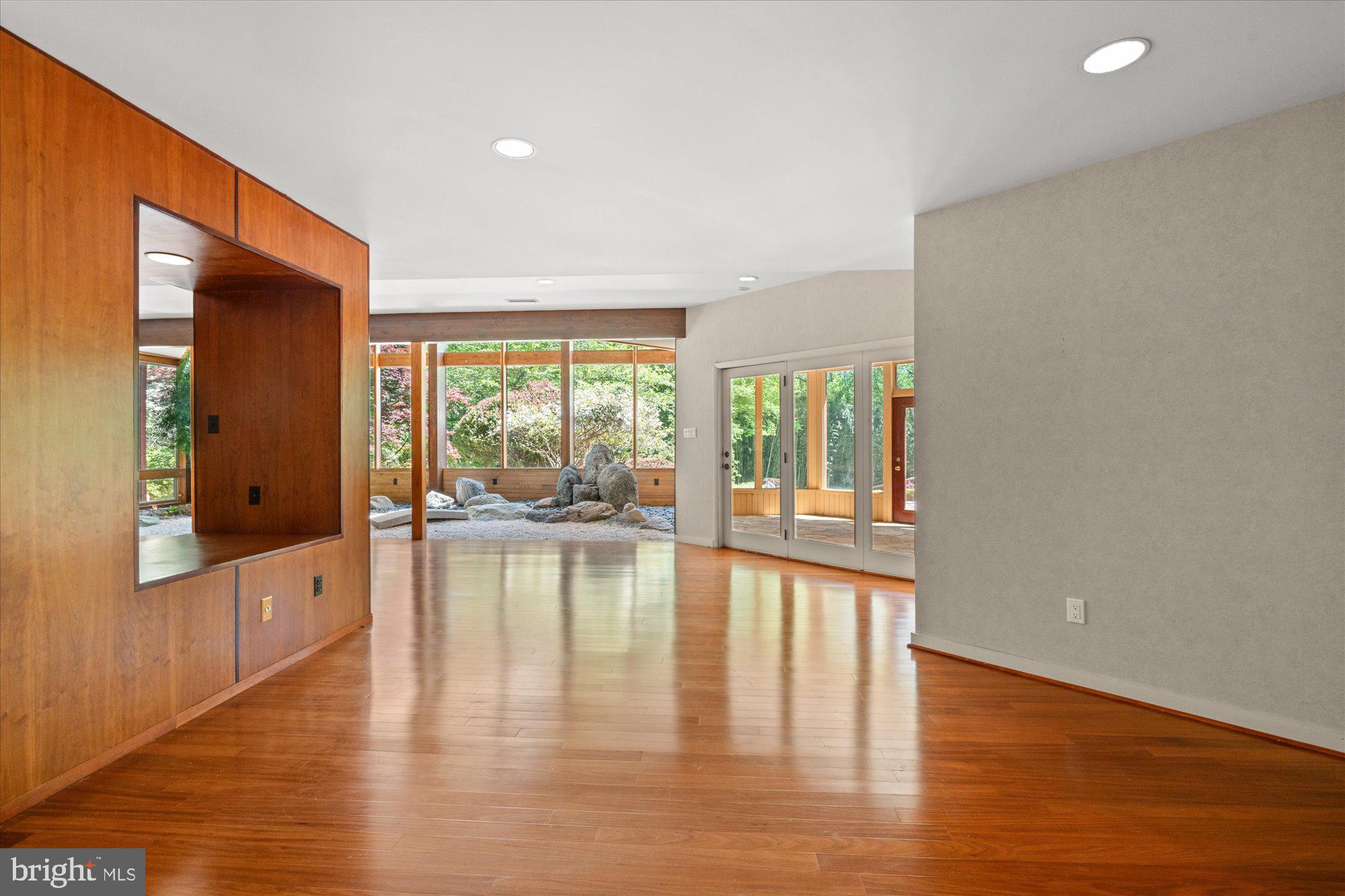 7211 Brickyard Road Potomac, MD 20854 - Photo 26 of 46 a view of empty room with wooden floor and fan
