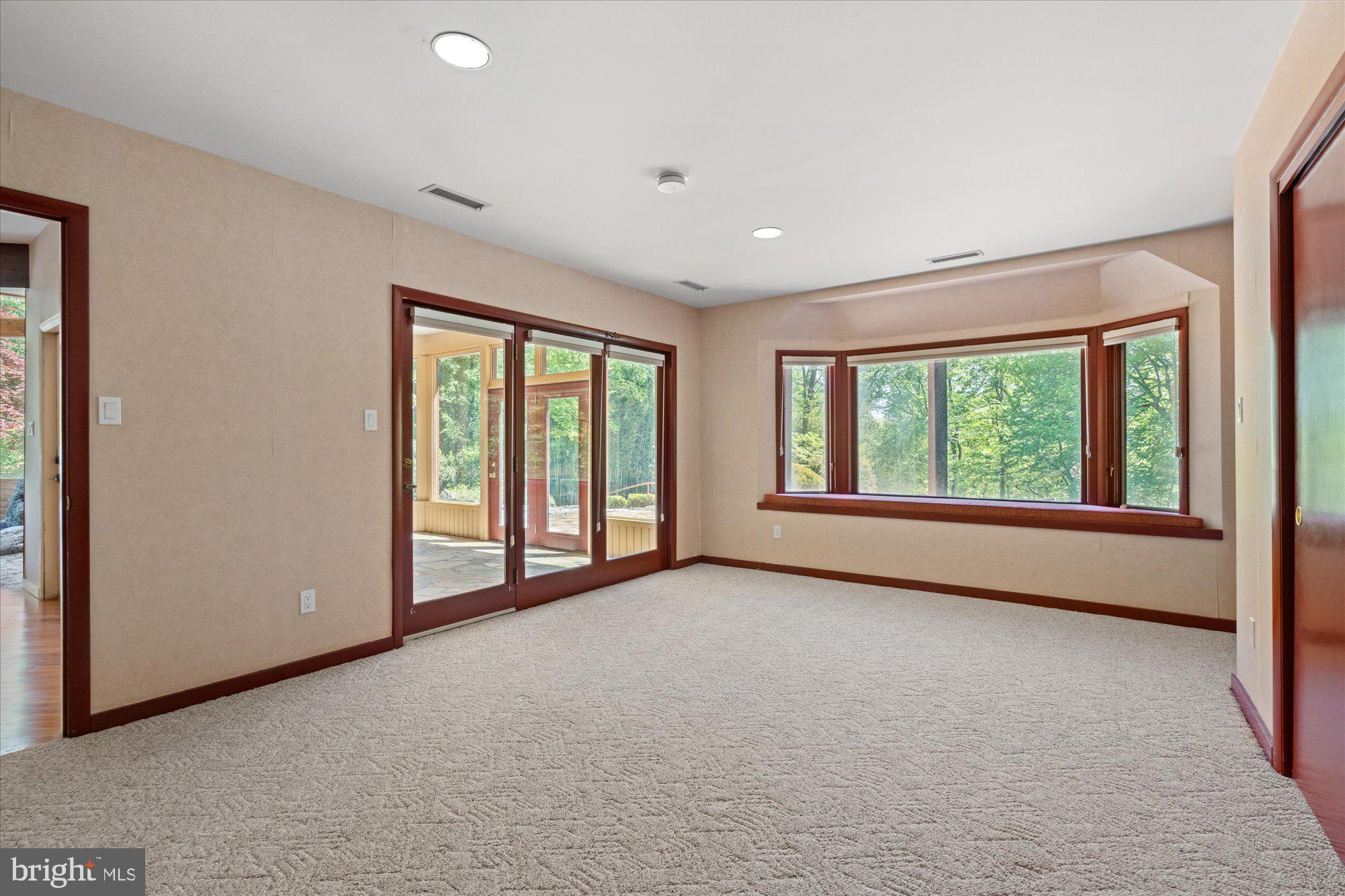 7211 Brickyard Road Potomac, MD 20854 - Photo 27 of 46 a view of an empty room with a window
