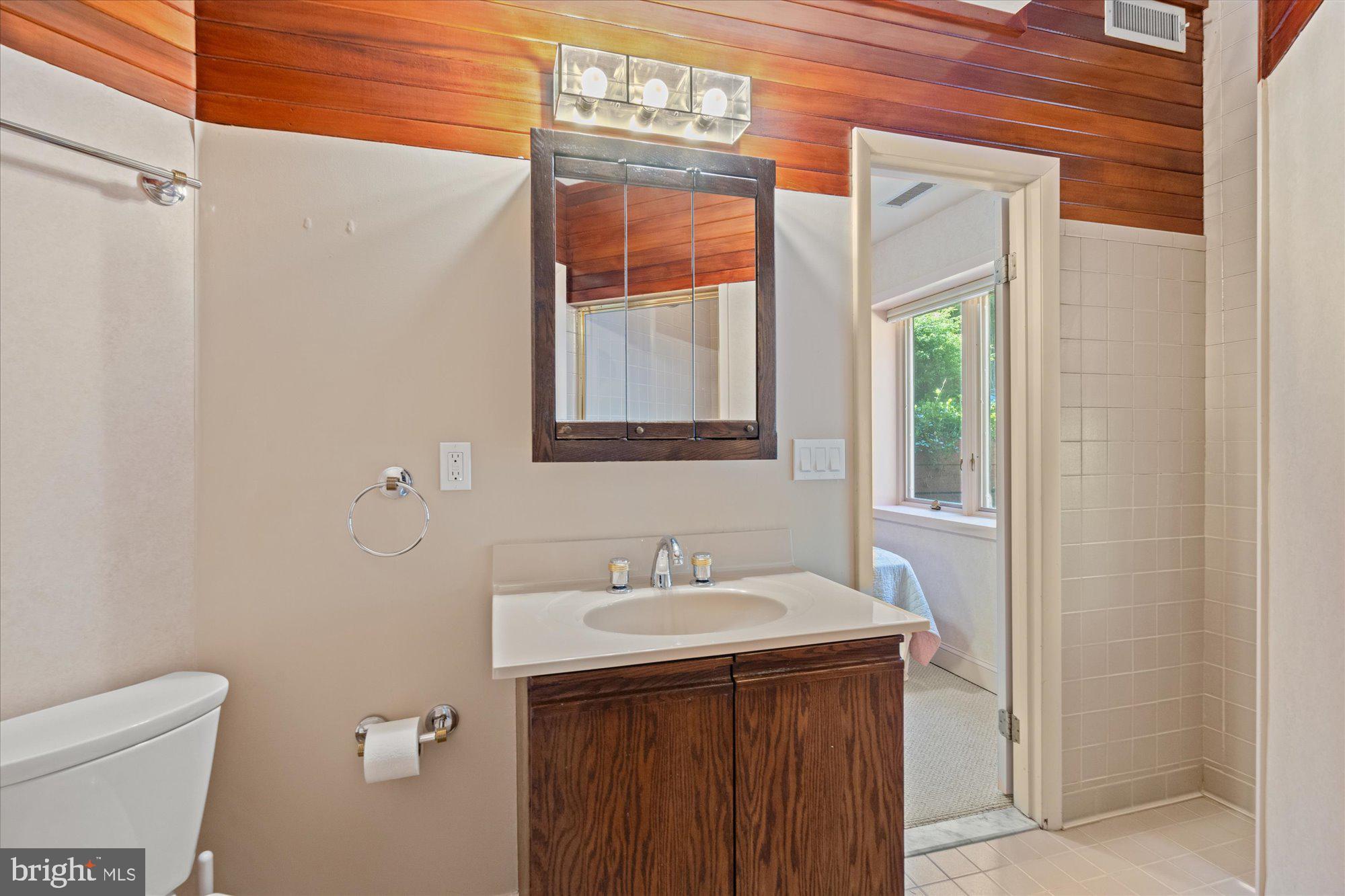 7211 Brickyard Road Potomac, MD 20854 - Photo 33 of 46 a bathroom with a sink and a mirror