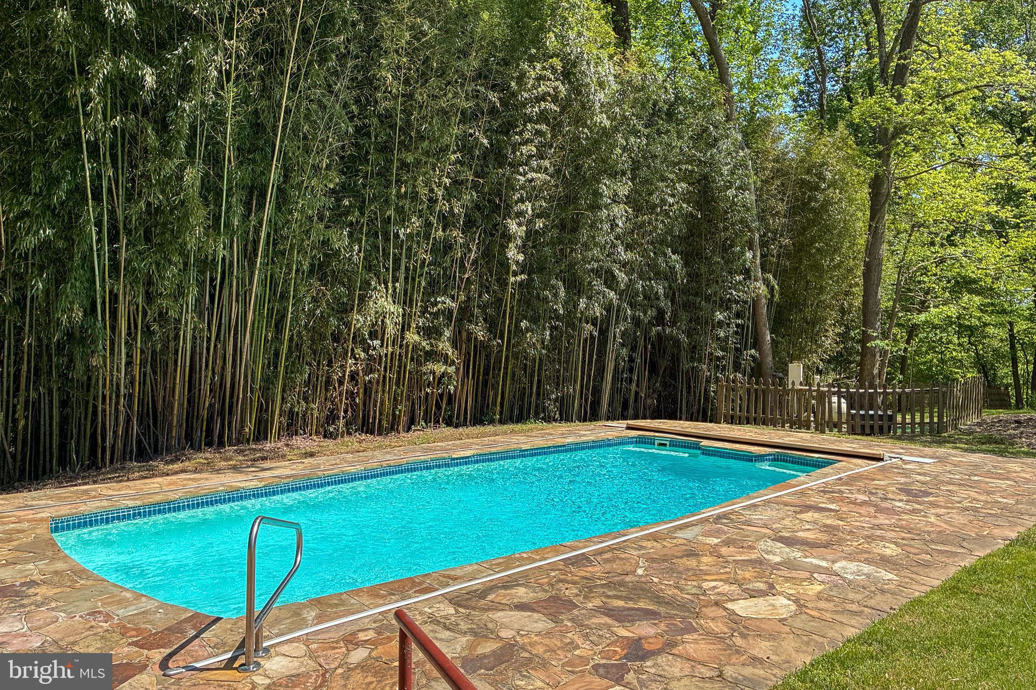 7211 Brickyard Road Potomac, MD 20854 - Photo 40 of 46 a view of a swimming pool with an outdoor space