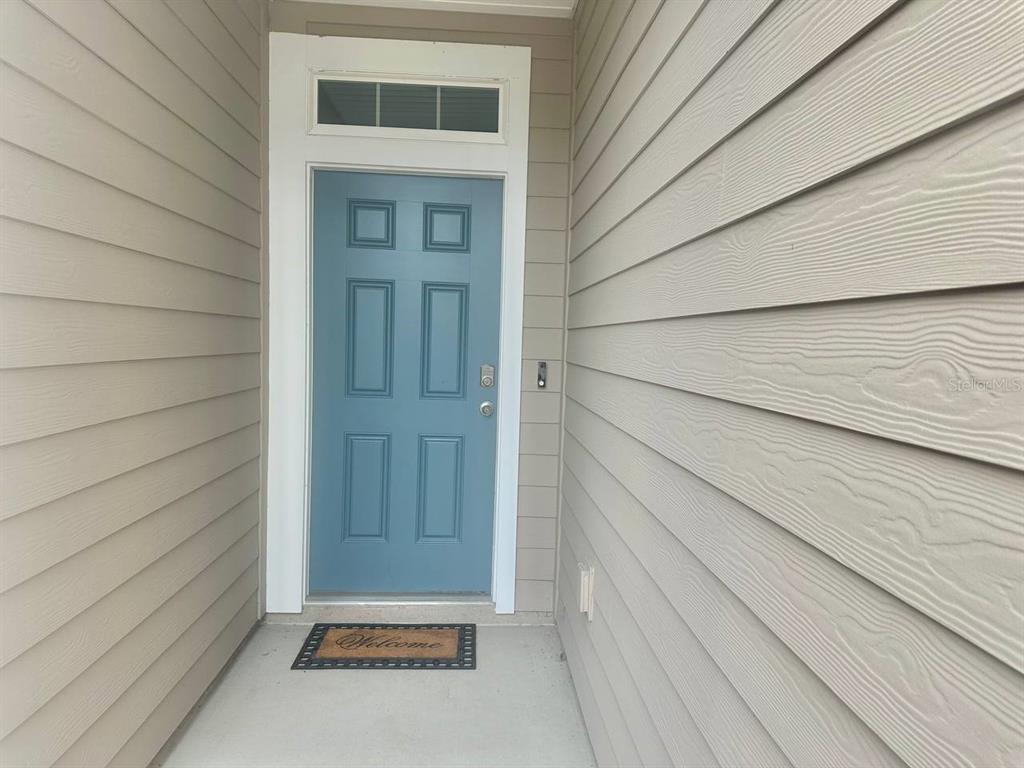 455 Redbud Road Palm Coast, FL 32137 - Photo 11 of 12 a view of front door of house