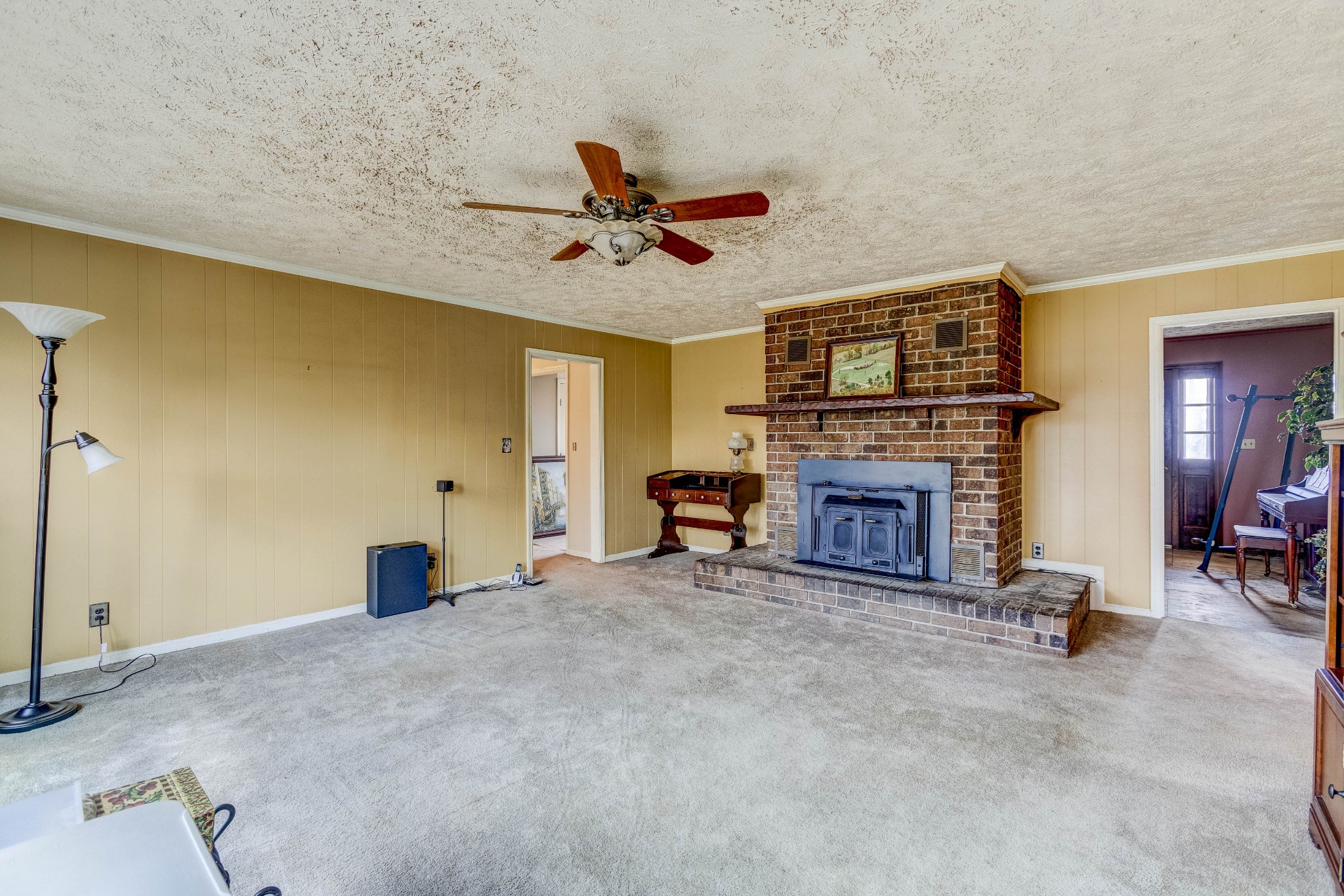 223 Lohman Road Mount Juliet, TN 37122 - Photo 5 of 15 a view of a livingroom with a fireplace and a chandelier