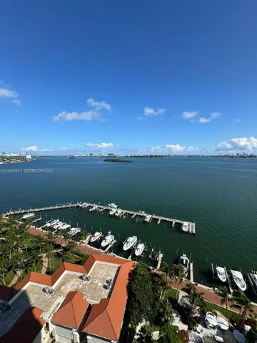 an aerial view of a houses with ocean view