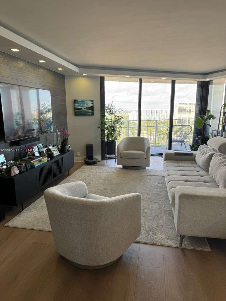 4000 Towerside Terrace, Unit 1901 Miami, FL 33138 - Photo 14 of 36 a living room with furniture and a large window
