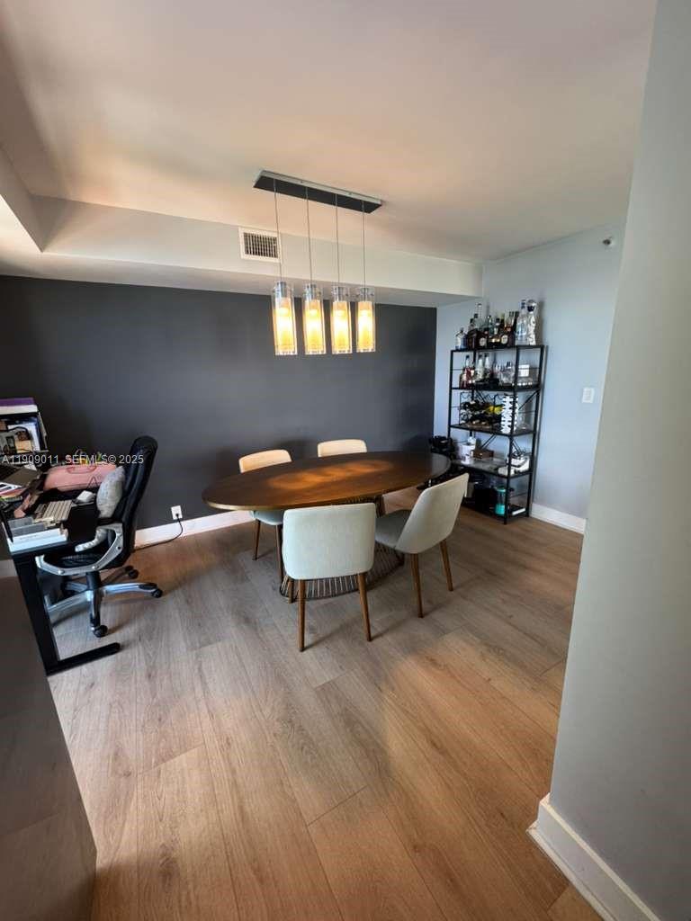 4000 Towerside Terrace, Unit 1901 Miami, FL 33138 - Photo 20 of 36 a reading room with furniture and wooden floor