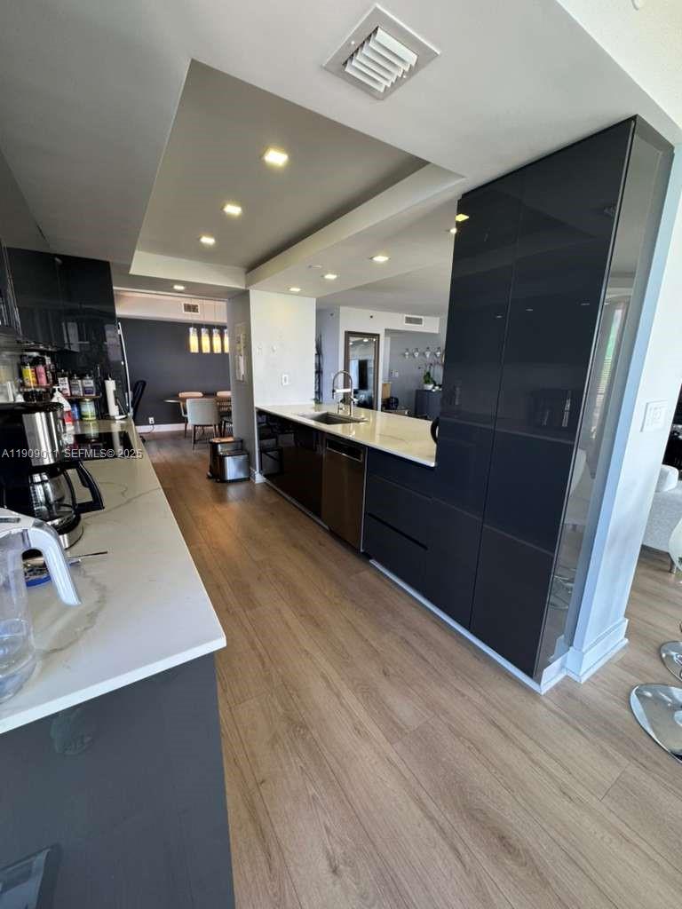 4000 Towerside Terrace, Unit 1901 Miami, FL 33138 - Photo 6 of 36 a room with lots of counter space