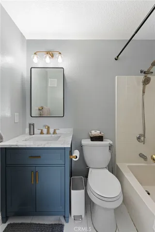 a bedroom with furniture and a gym equipment