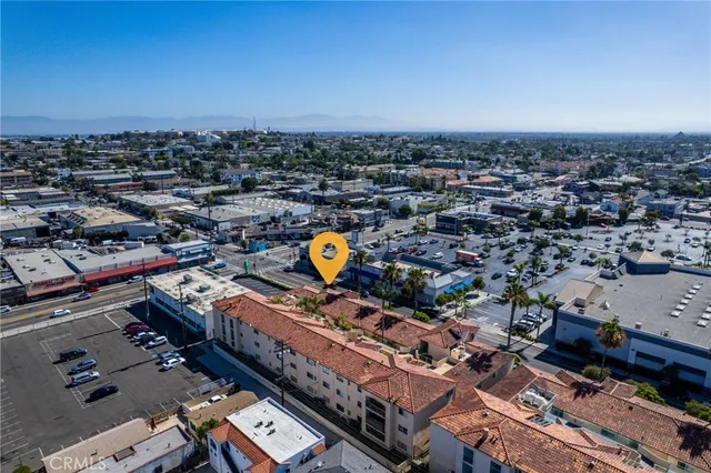 an aerial view of residential houses with city view