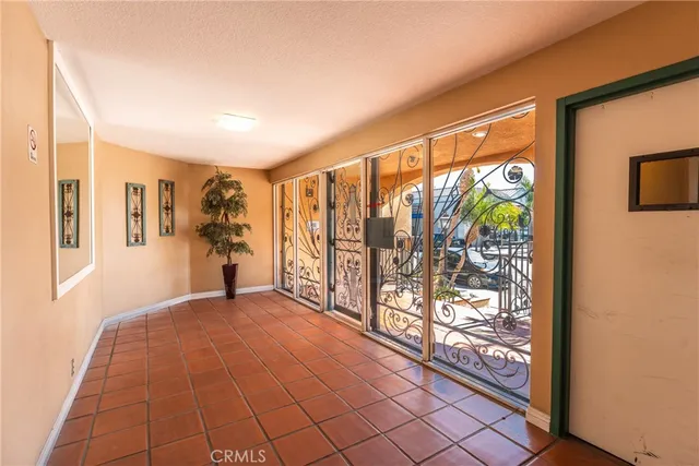 a view of an empty room and a window