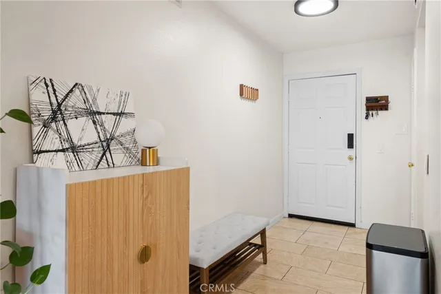 a kitchen with a sink a stove cabinets and a window