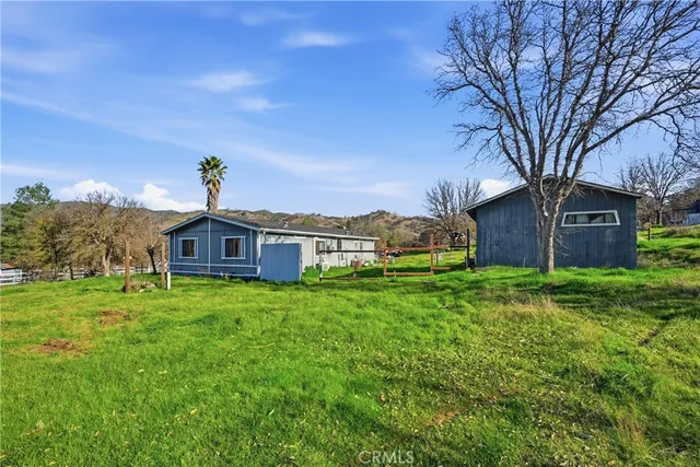 a view of a house with a big yard