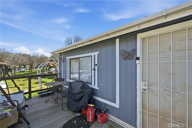 a balcony with furniture and a potted plant
