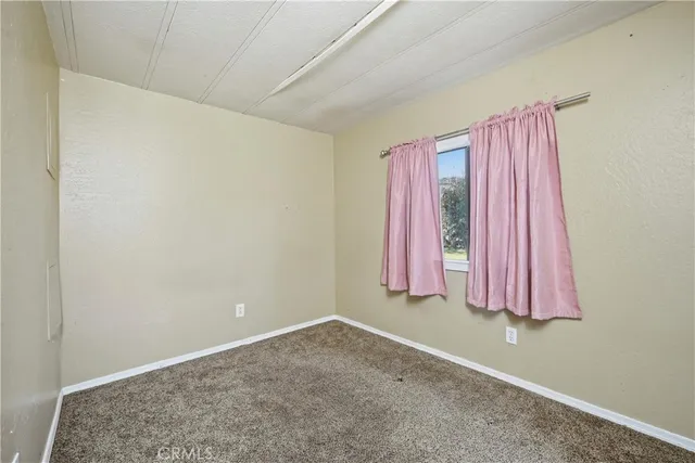 a view of a room with window and closet