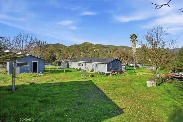 a view of a house with a big yard