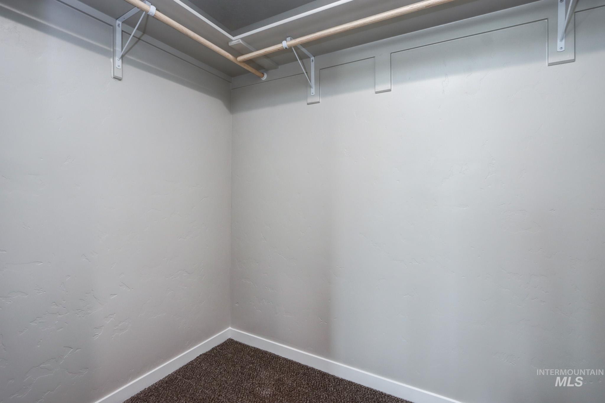 824 North 5th Street Nyssa, OR 97913 - Photo 12 of 23 Walk in closet with dark colored carpet