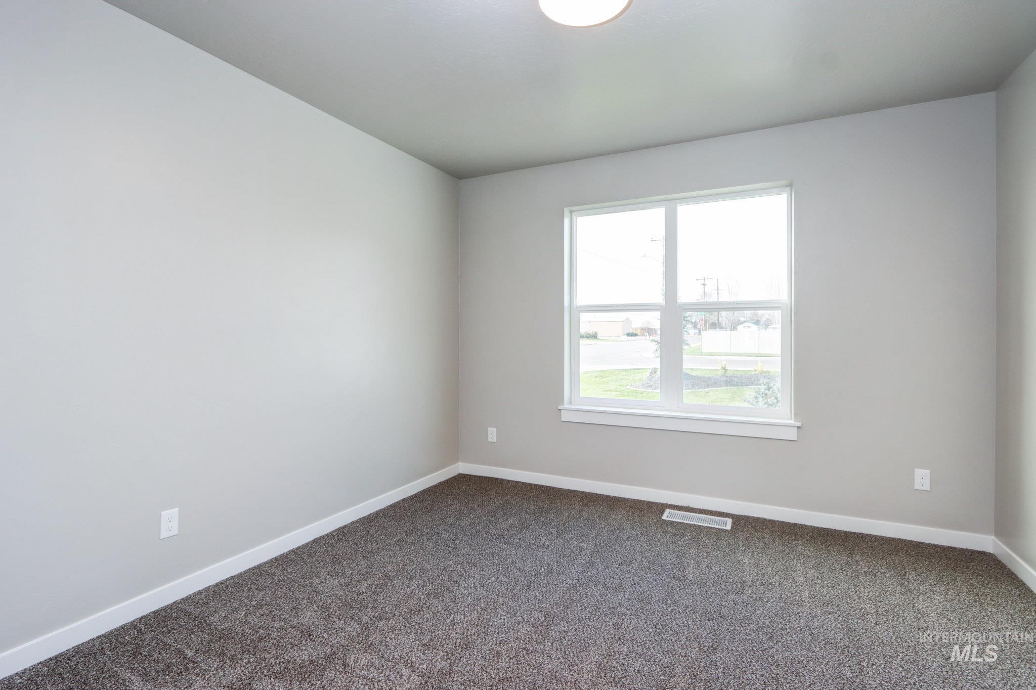 824 North 5th Street Nyssa, OR 97913 - Photo 20 of 23 Empty room featuring baseboards and dark colored carpet