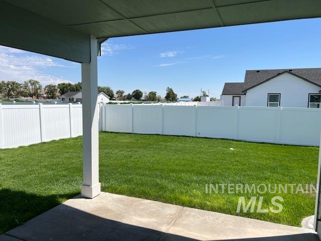 824 North 5th Street Nyssa, OR 97913 - Photo 8 of 23 Fenced backyard with a patio
