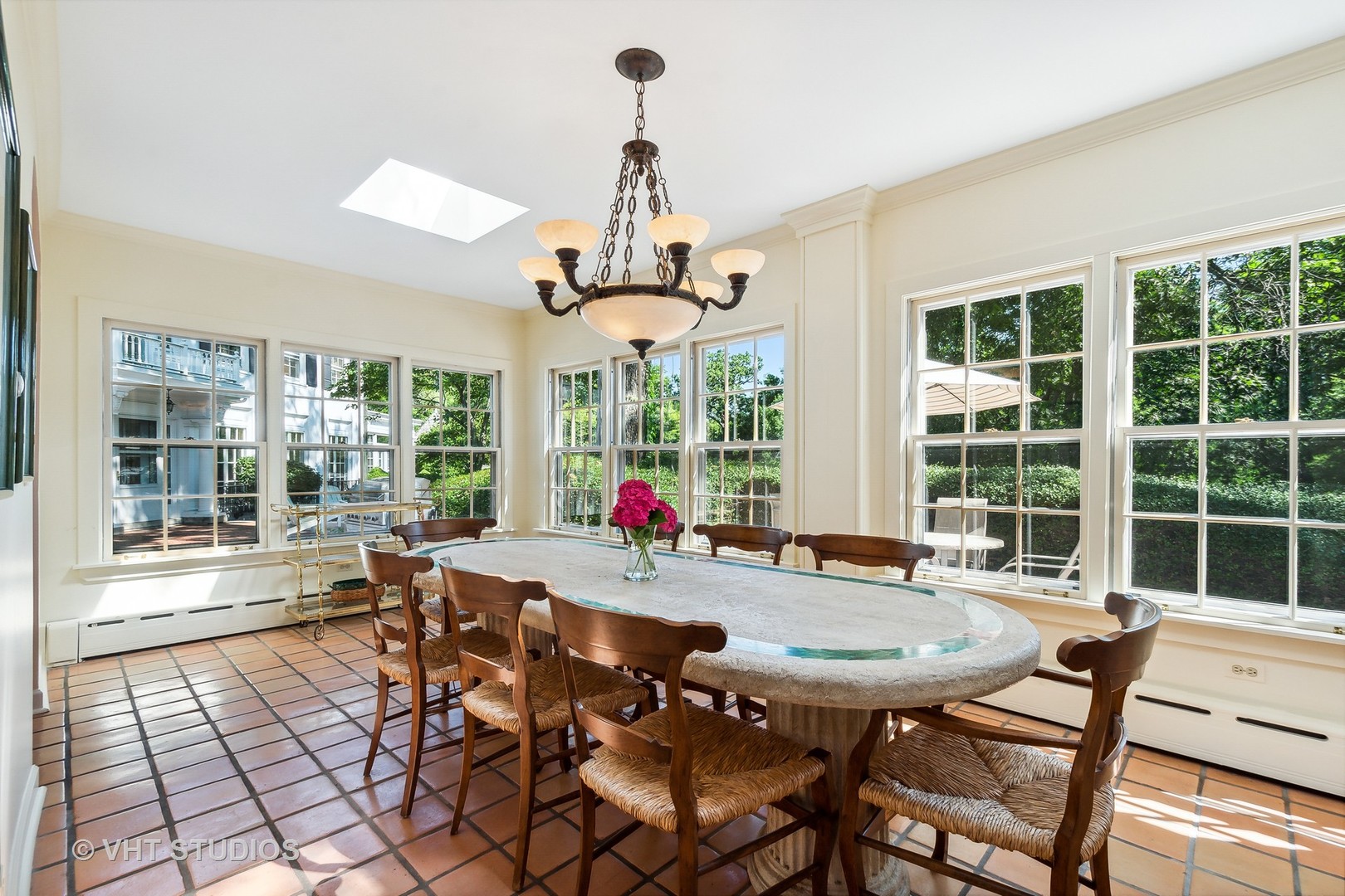 5 West County Line Road Barrington Hills, IL 60010 - Photo 18 of 77 a view of a dining room with furniture large windows and wooden floor