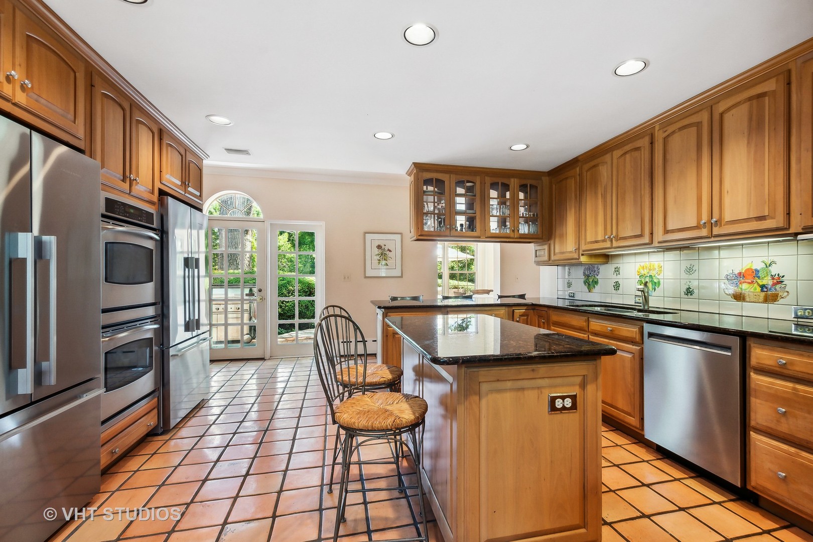5 West County Line Road Barrington Hills, IL 60010 - Photo 20 of 77 a kitchen with stainless steel appliances granite countertop a stove a sink dishwasher and a refrigerator with wooden cabinets