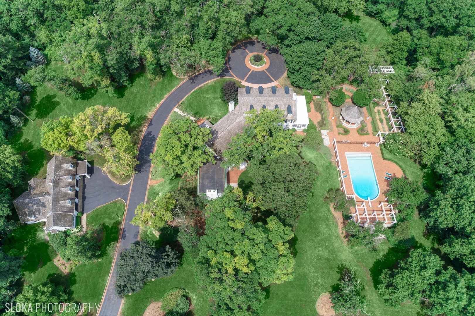 5 West County Line Road Barrington Hills, IL 60010 - Photo 2 of 77 an aerial view of a house with outdoor space and street view
