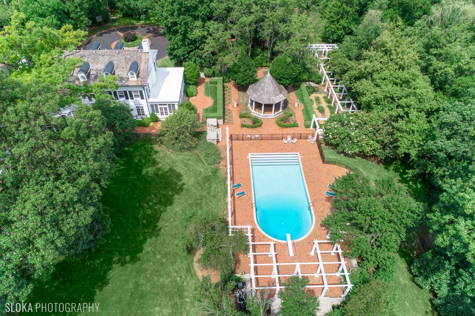 5 West County Line Road Barrington Hills, IL 60010 - Photo 3 of 77 an aerial view of a house with outdoor space and tennis court