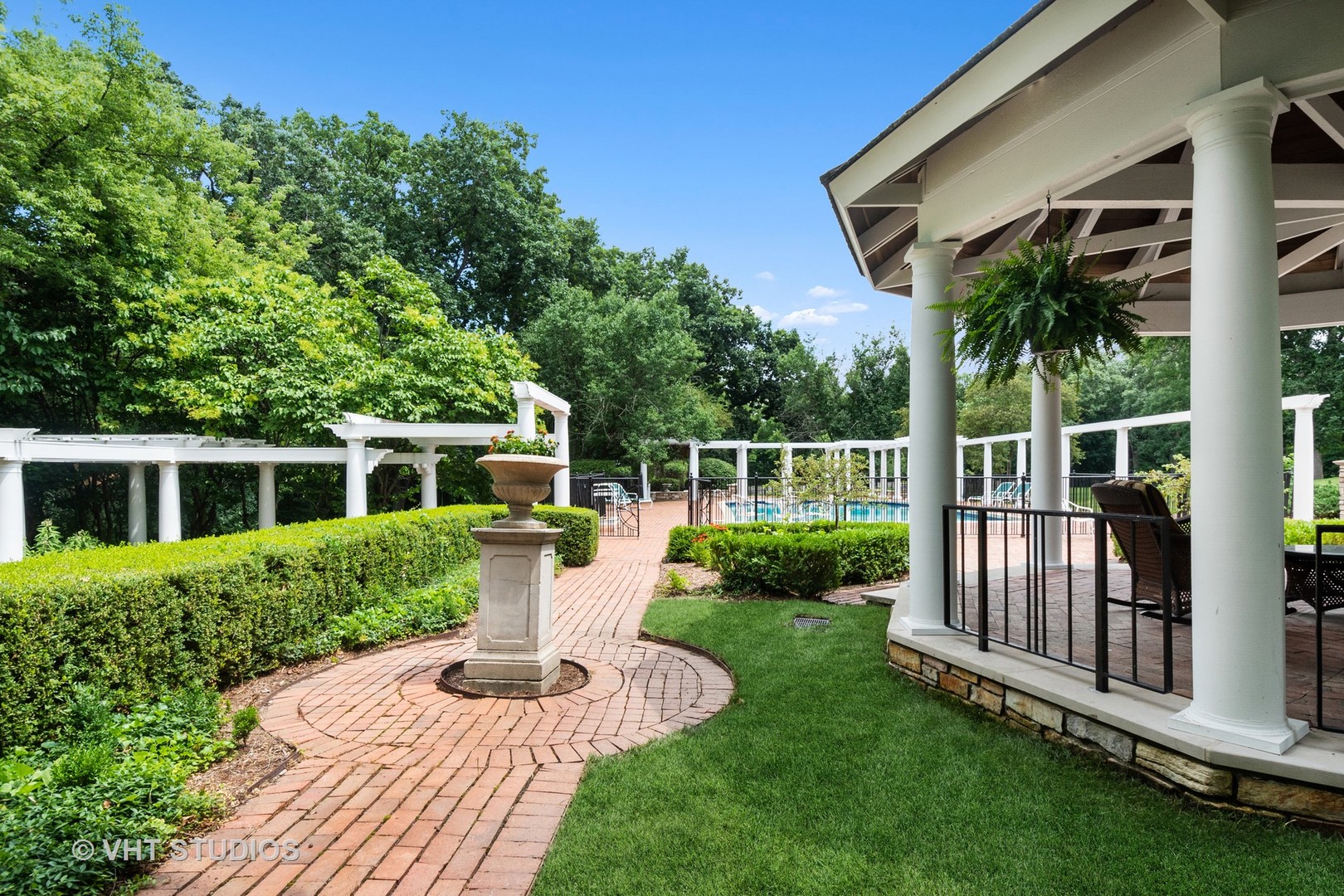 5 West County Line Road Barrington Hills, IL 60010 - Photo 46 of 77 a front view of a house with yard porch and green space