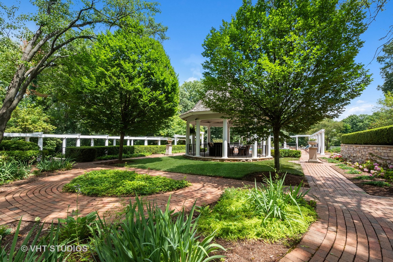 5 West County Line Road Barrington Hills, IL 60010 - Photo 47 of 77 a view of a garden with wooden fence