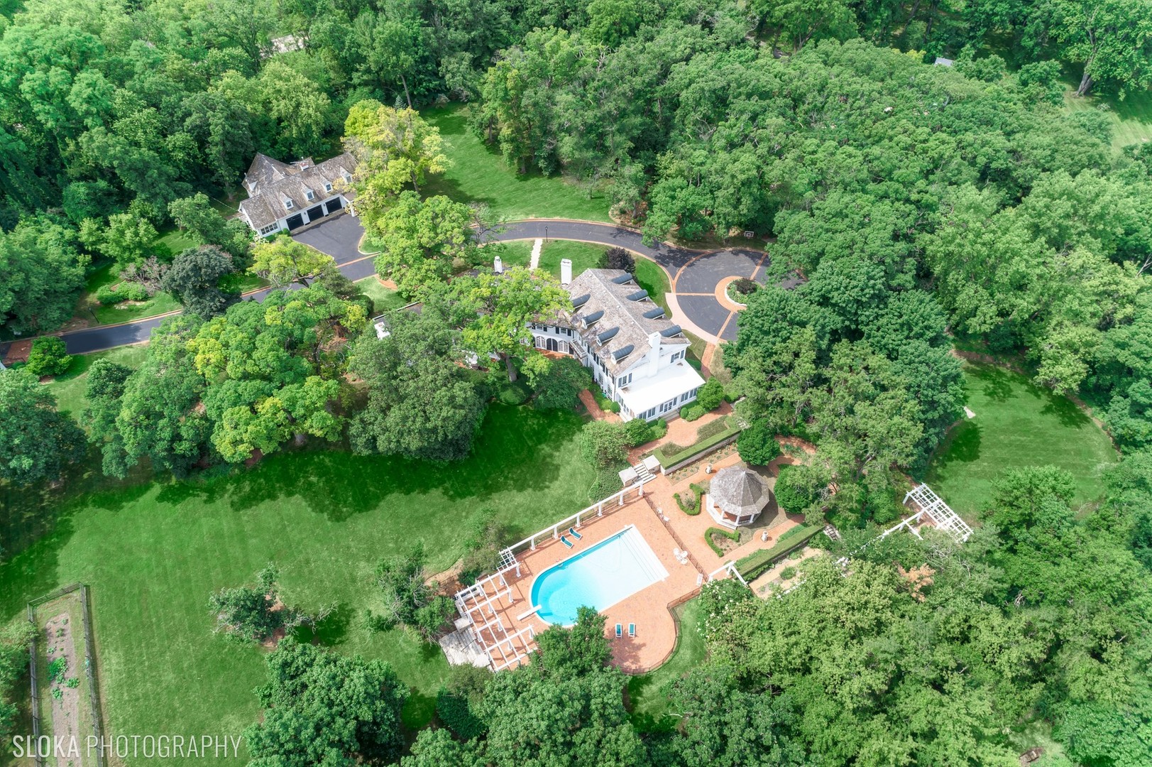 5 West County Line Road Barrington Hills, IL 60010 - Photo 50 of 77 an aerial view of residential house with outdoor space and trees all around