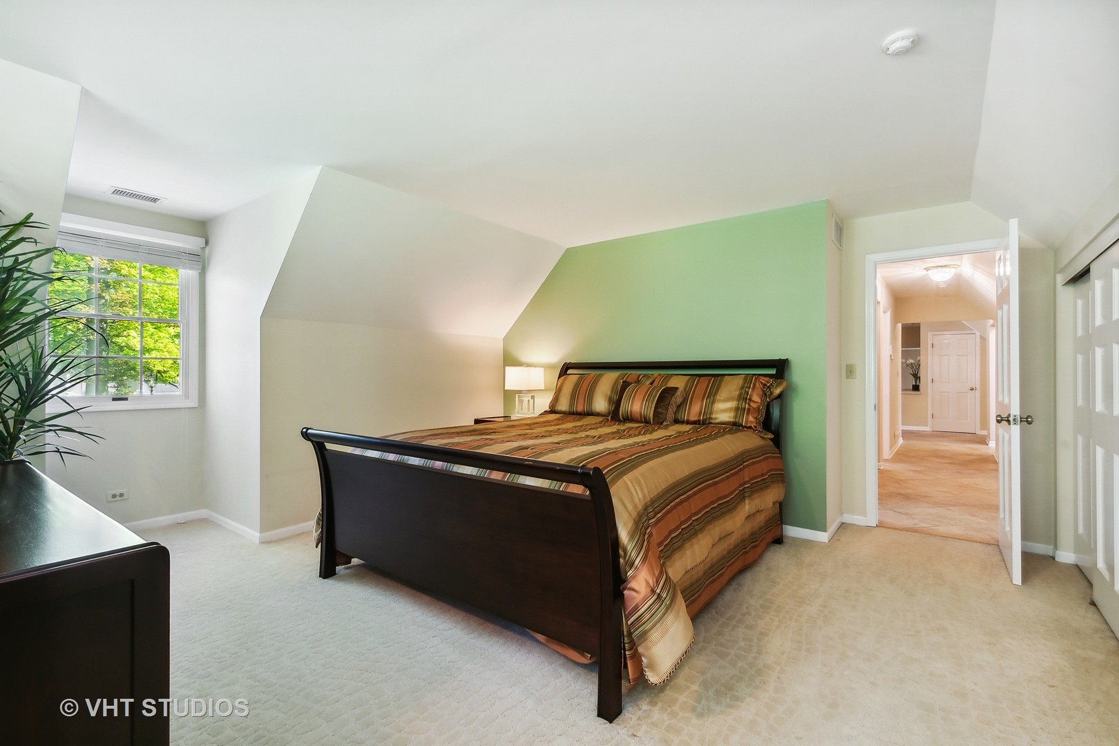 5 West County Line Road Barrington Hills, IL 60010 - Photo 56 of 77 a bedroom with a bed and a potted plant