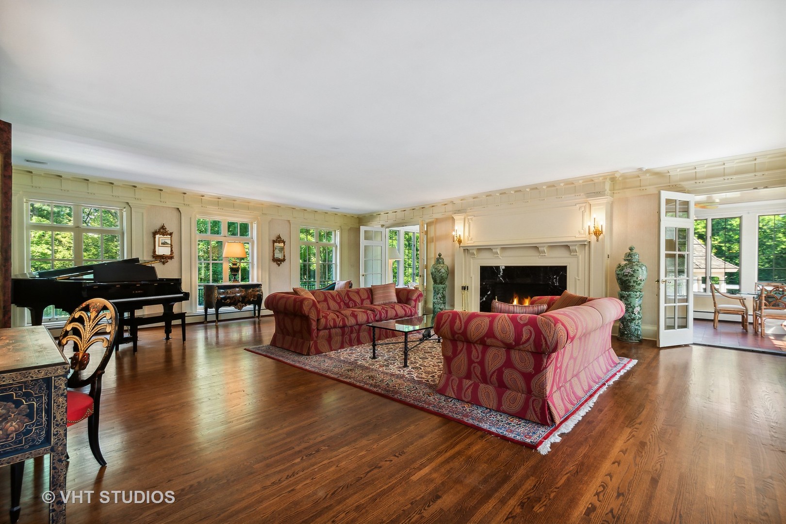 5 West County Line Road Barrington Hills, IL 60010 - Photo 9 of 77 a living room with furniture a flat screen tv and a fireplace