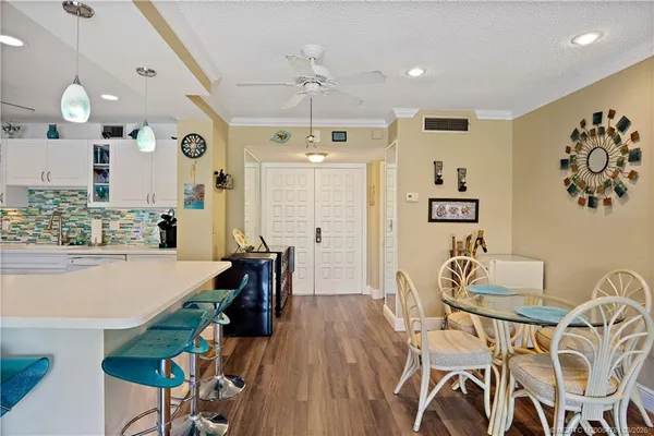a view of a dining room with furniture window and outside view