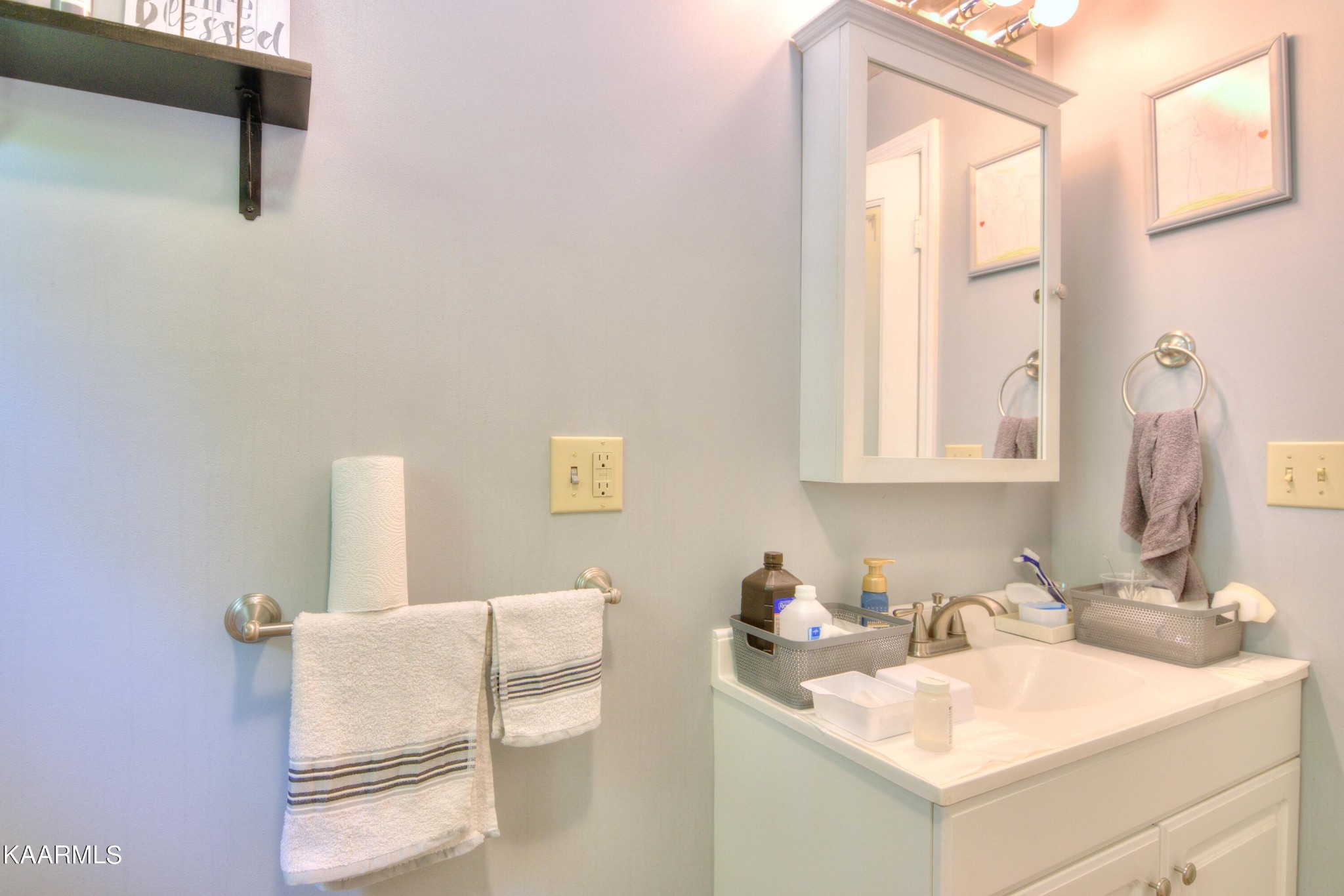 1311 Belltown Road Tellico Plains, TN 37385 - Photo 17 of 58 a bathroom with a sink vanity and a mirror