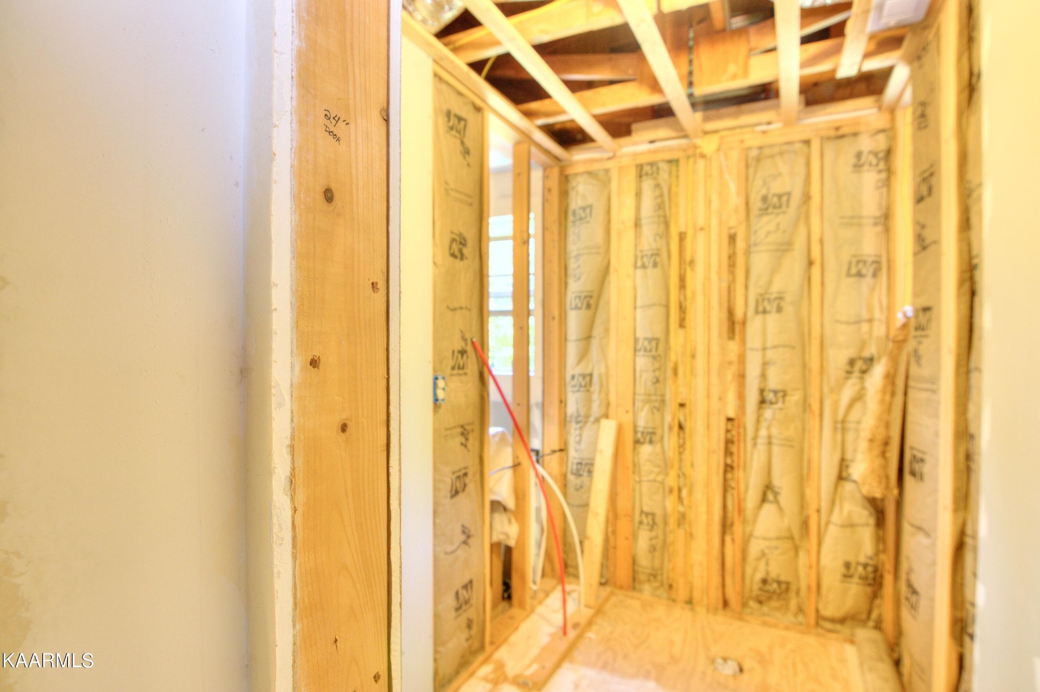 1311 Belltown Road Tellico Plains, TN 37385 - Photo 18 of 58 a view of a bathroom with a shower curtain