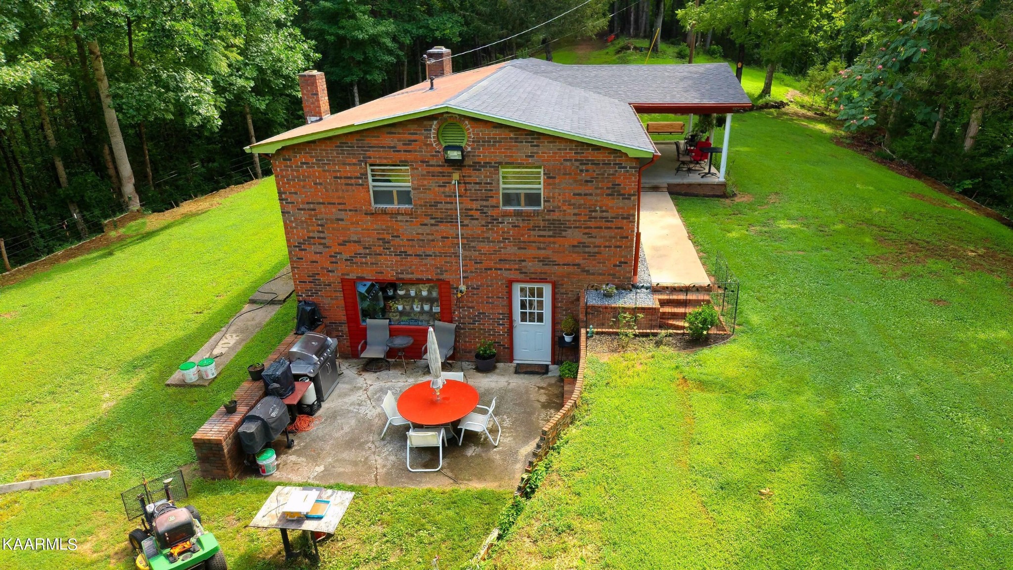 1311 Belltown Road Tellico Plains, TN 37385 - Photo 58 of 58 a aerial view of a house with swimming pool garden view and trees