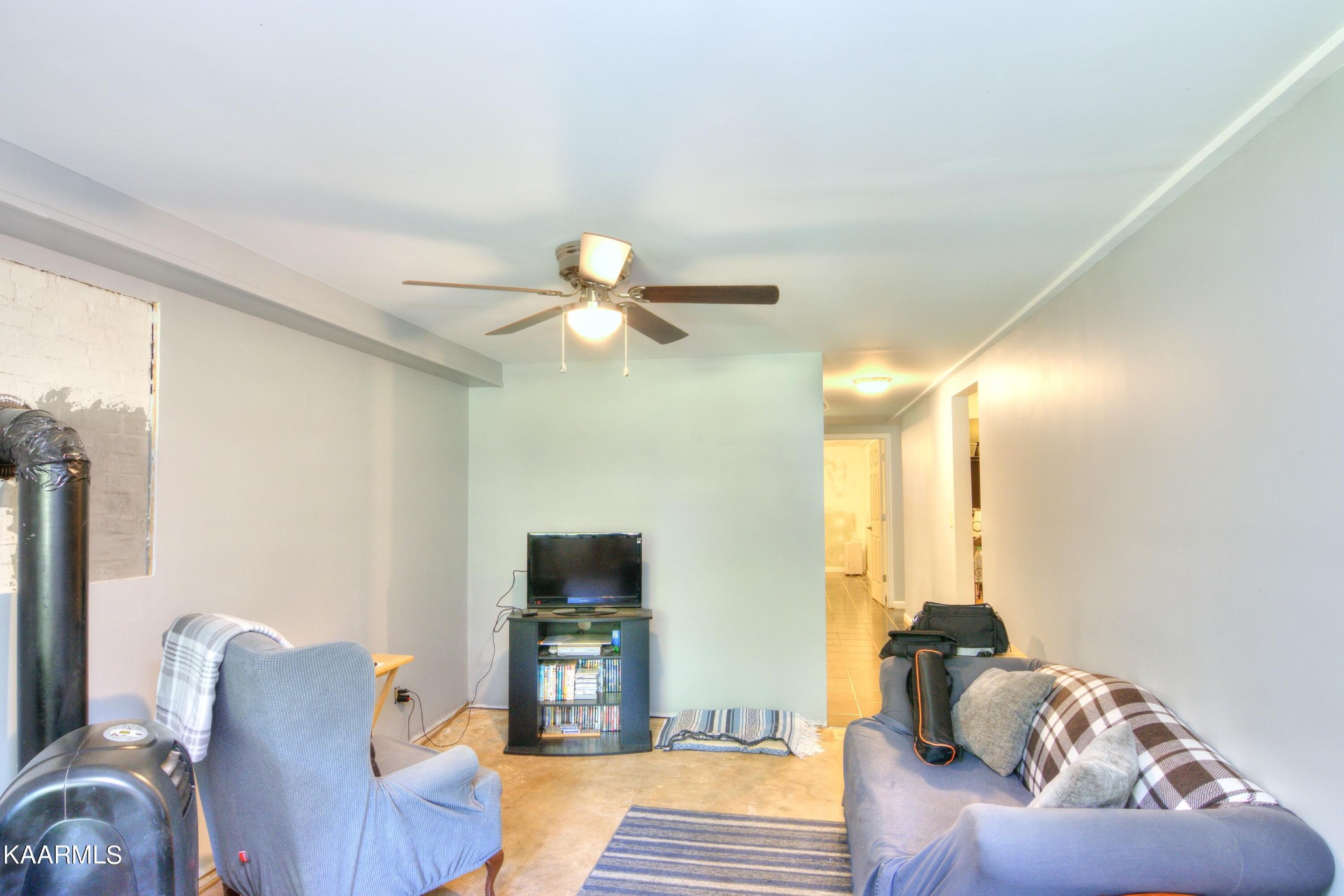 1311 Belltown Road Tellico Plains, TN 37385 - Photo 6 of 58 a living room with furniture and a flat screen tv