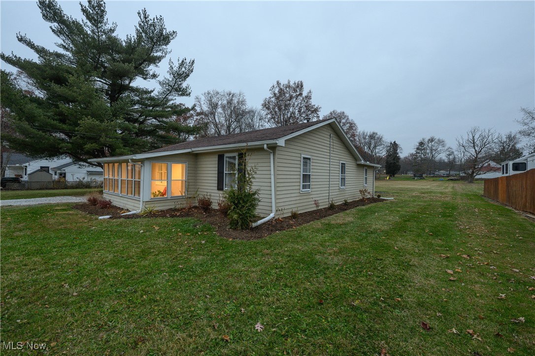 451 Yager Road Clinton, OH 44216 - Photo 4 of 25 View of property exterior with a sunroom