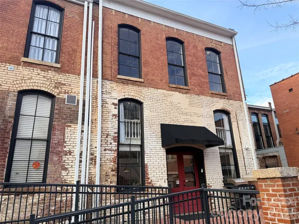 a front view of a house with glass windows