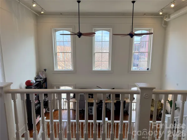 a view of a living room with windows