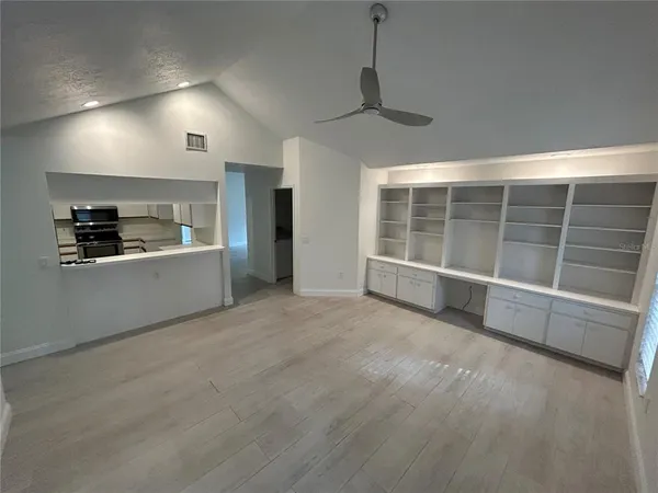 a view of an empty room with a window