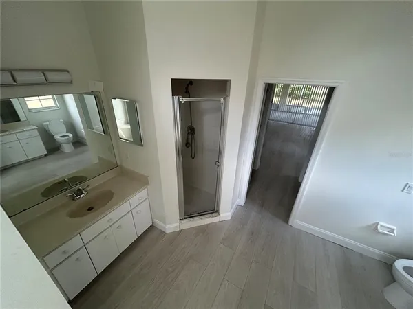 a view of an empty room with windows