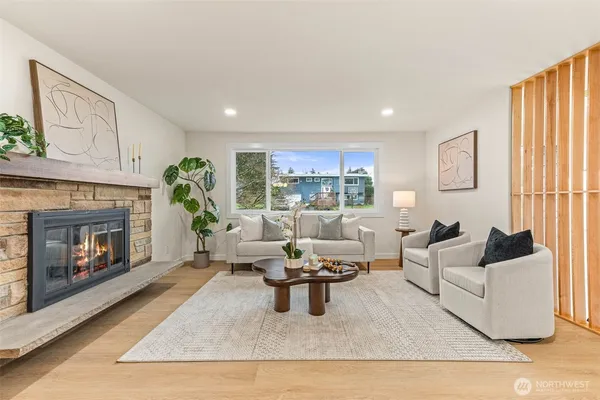 a living room with furniture and a potted plant