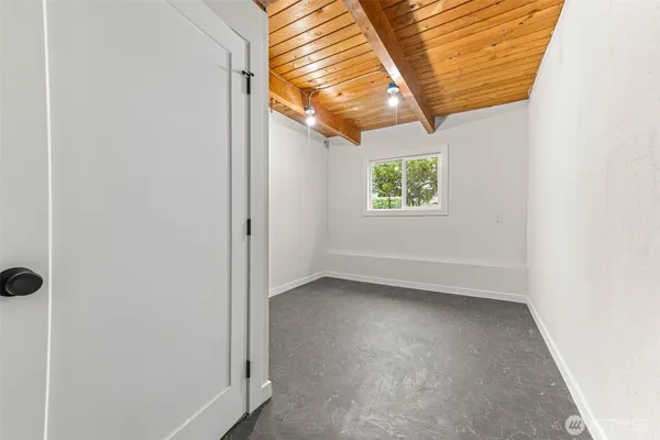 a kitchen with stainless steel appliances kitchen island granite countertop a refrigerator and a stove