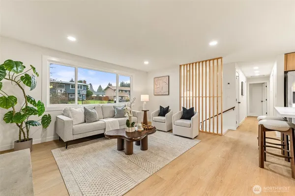 a living room with furniture and a large window