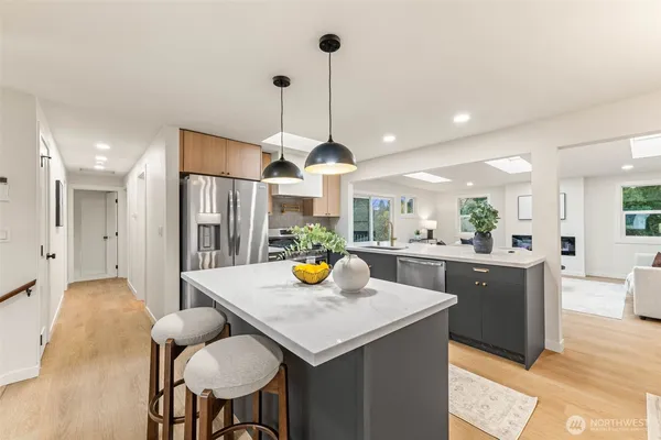 a kitchen with sink and refrigerator
