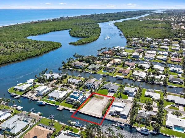 an aerial view of a house with a lake view