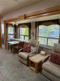 a living room with furniture and windows