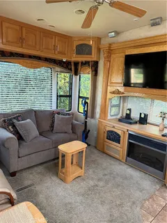 a living room with furniture a window and kitchen view