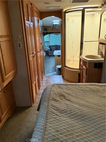 a view of a hallway with furniture and a window
