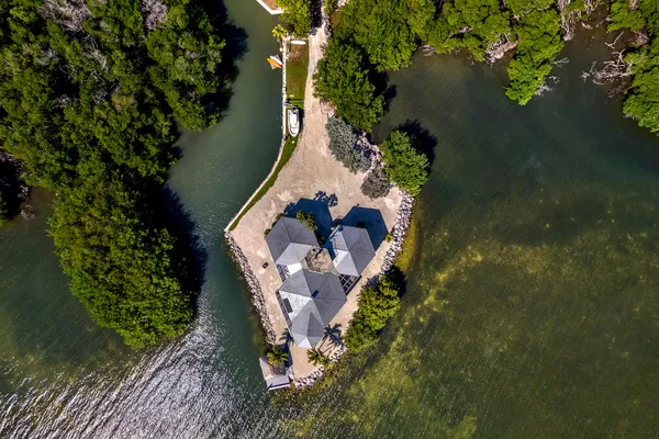 an aerial view of a houses with a lake view