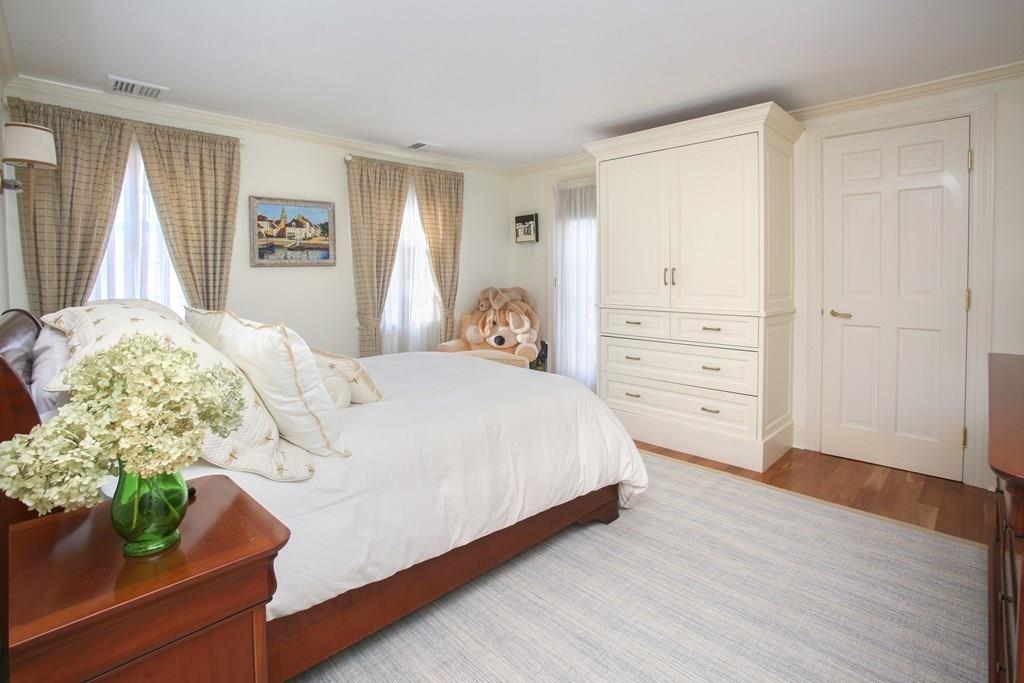 97 Laurel Road Brookline, MA 02467 - Photo 17 of 33 a bedroom with bed and window